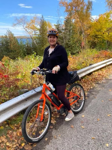 Woman enjoy a Fall Bike Ride with an Electric Bike rented from Dubuque E-Bikes